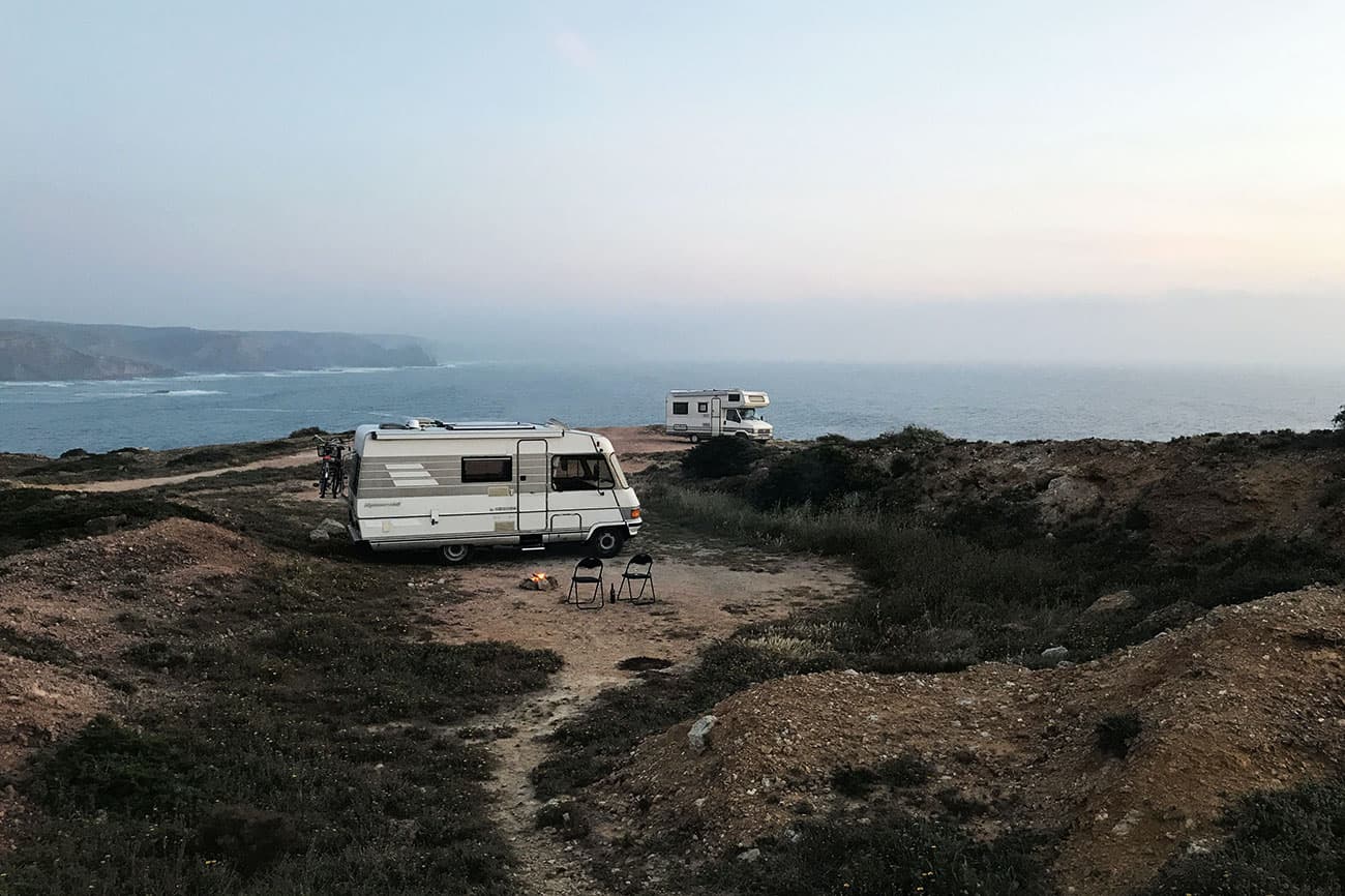 Camper van by the coast at dawn